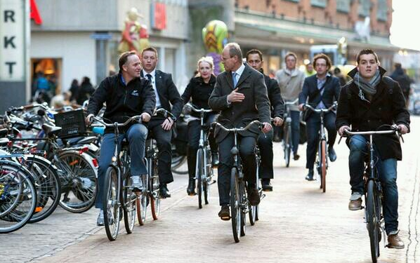 John Key, New Zealand Prime Minister, modelling Wheeled Pedestrian Cycling